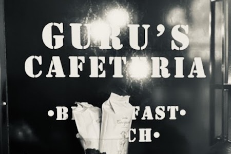 The Guru's Cafeteria name painted on the wall inside the cafe